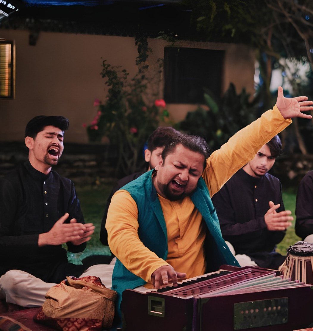Musicians singing with harmonium and tabla
